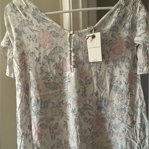 Lucky brand top brand new with tag ! Mostly white , beautiful floral design